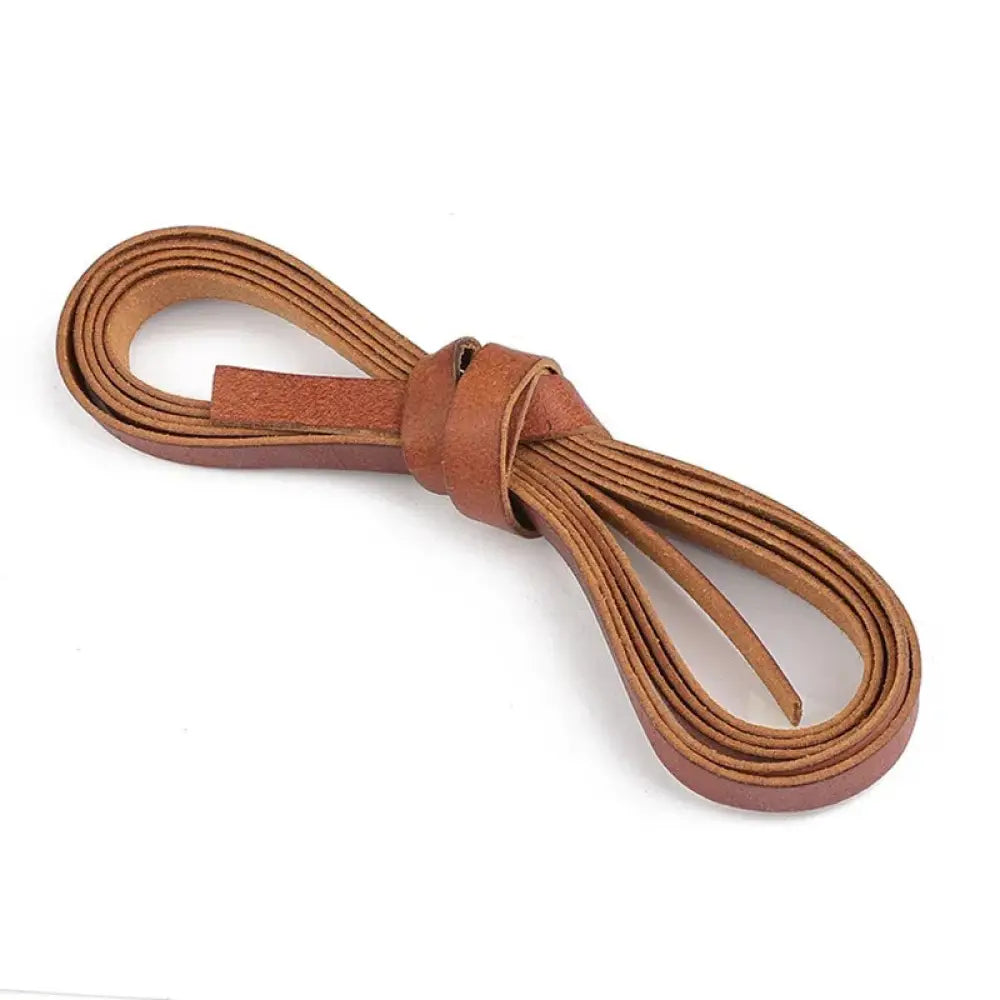 Handmade genuine leather cord in tan with a simple knot for diy crafting projects