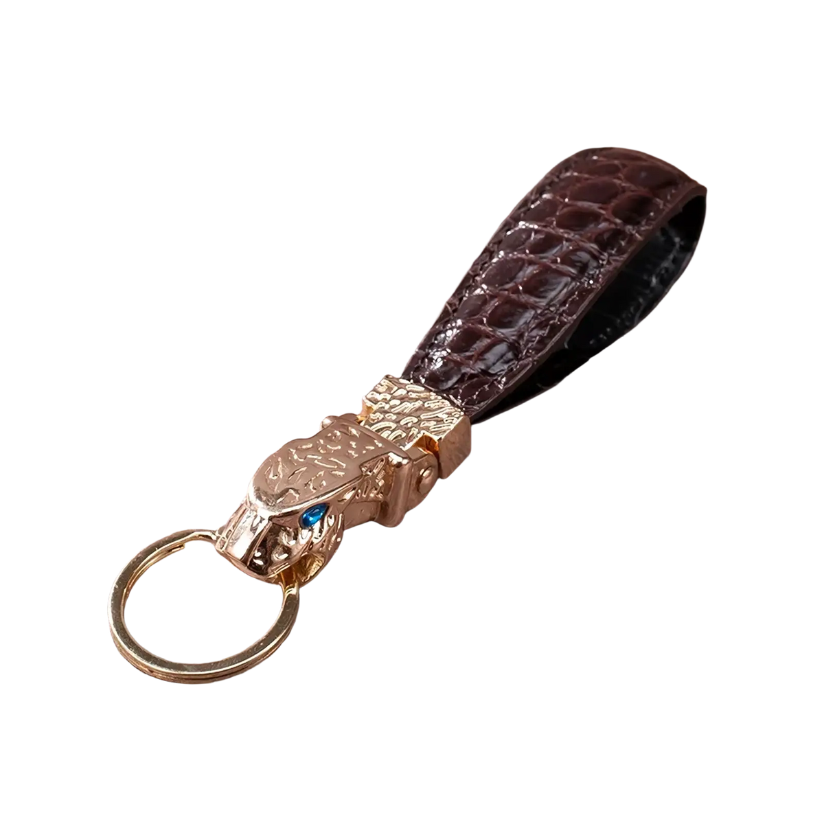 Leather tiger head keychain with gold-toned leopard head, dark brown crocodile leather strap, and blue gemstone eyes