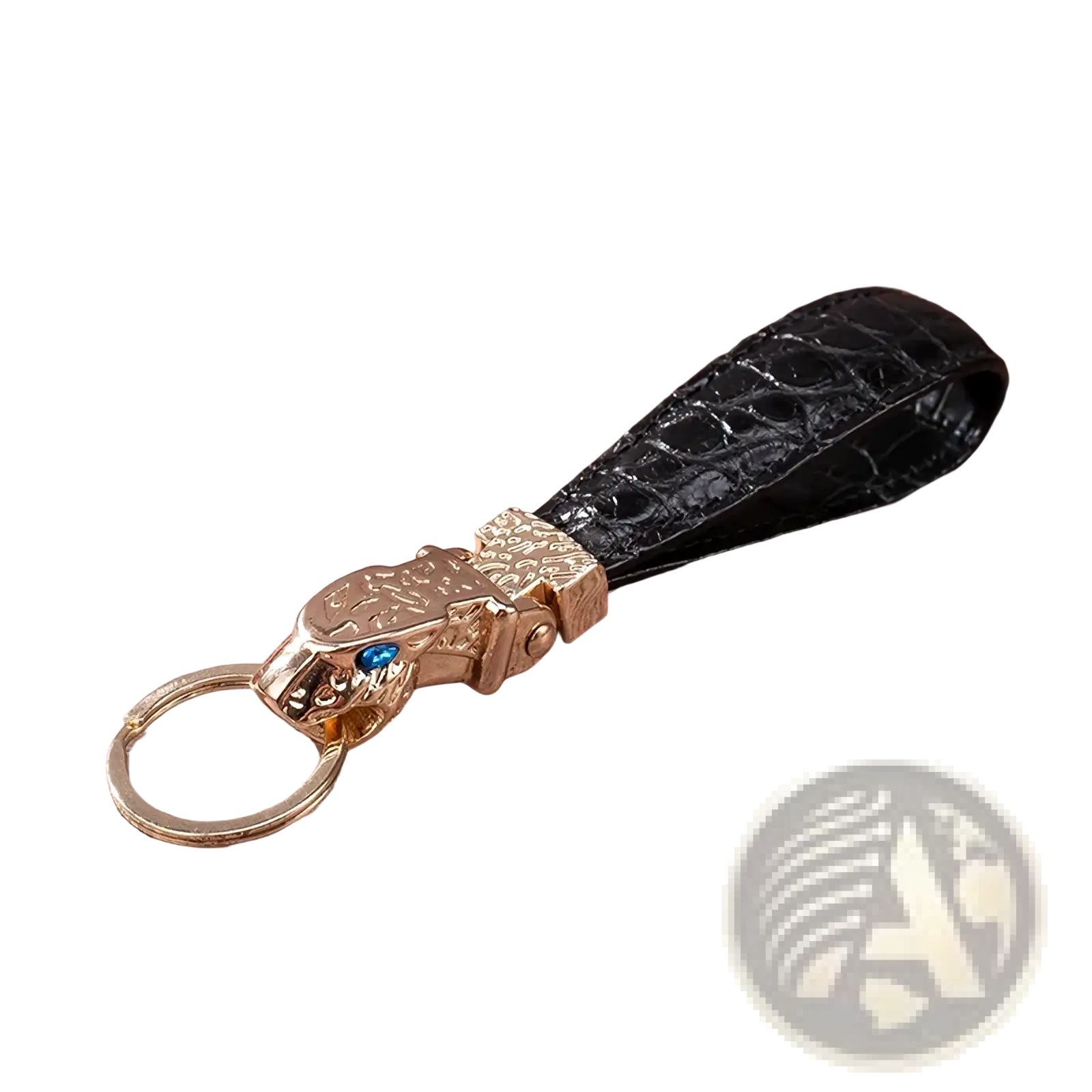 Black crocodile leather luxury keychain with gold-toned tiger head charm featuring a blue gemstone for car keys