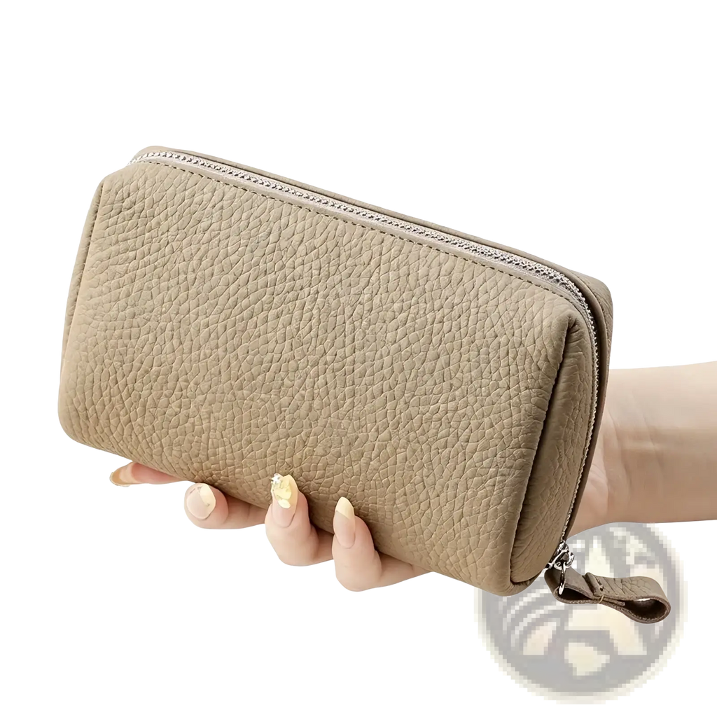 Beige textured leather toiletry bag for women with silver zipper and pull tab mini cosmetic pouch