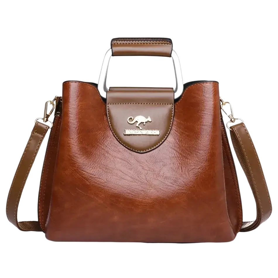 Brown leather tote bag with pocket interior, silver kangaroo logo plaque, and metal handle for stylish carrying