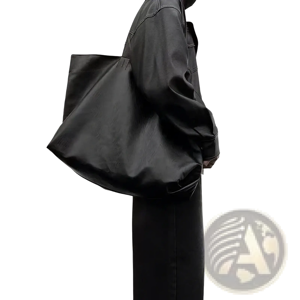 Black leather tote bag with large capacity designed for commuter and shopper use