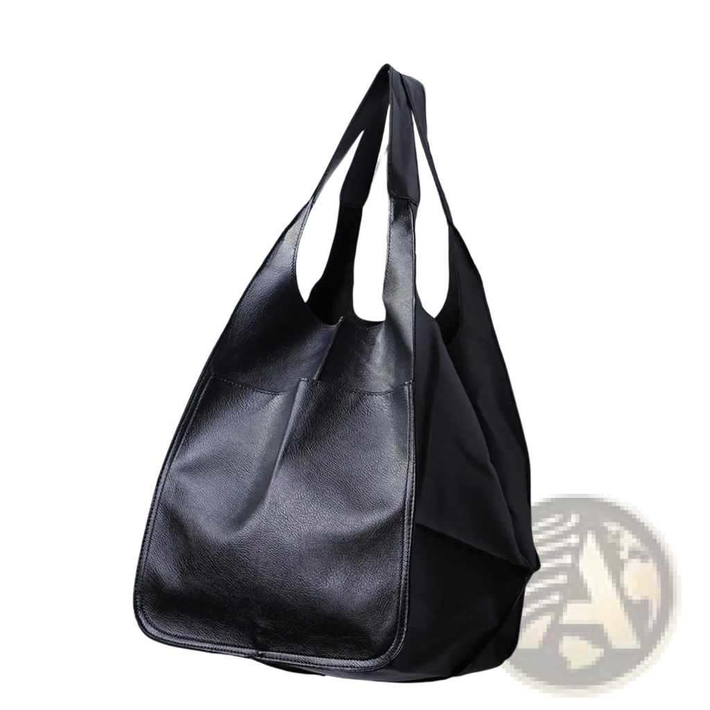 Black leather tote bag with soft textured surface and two sturdy handles large capacity slouchy shoulder bag