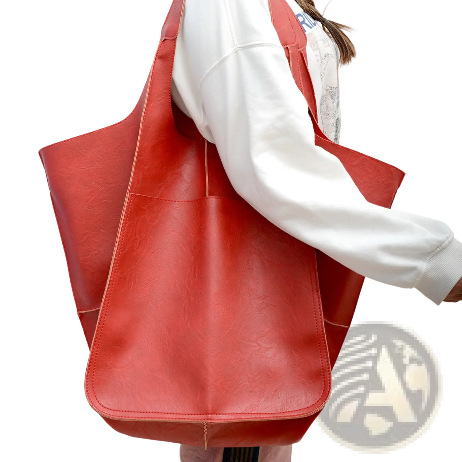 A vibrant red large capacity leather tote bag with smooth faux leather finish and visible stitching details