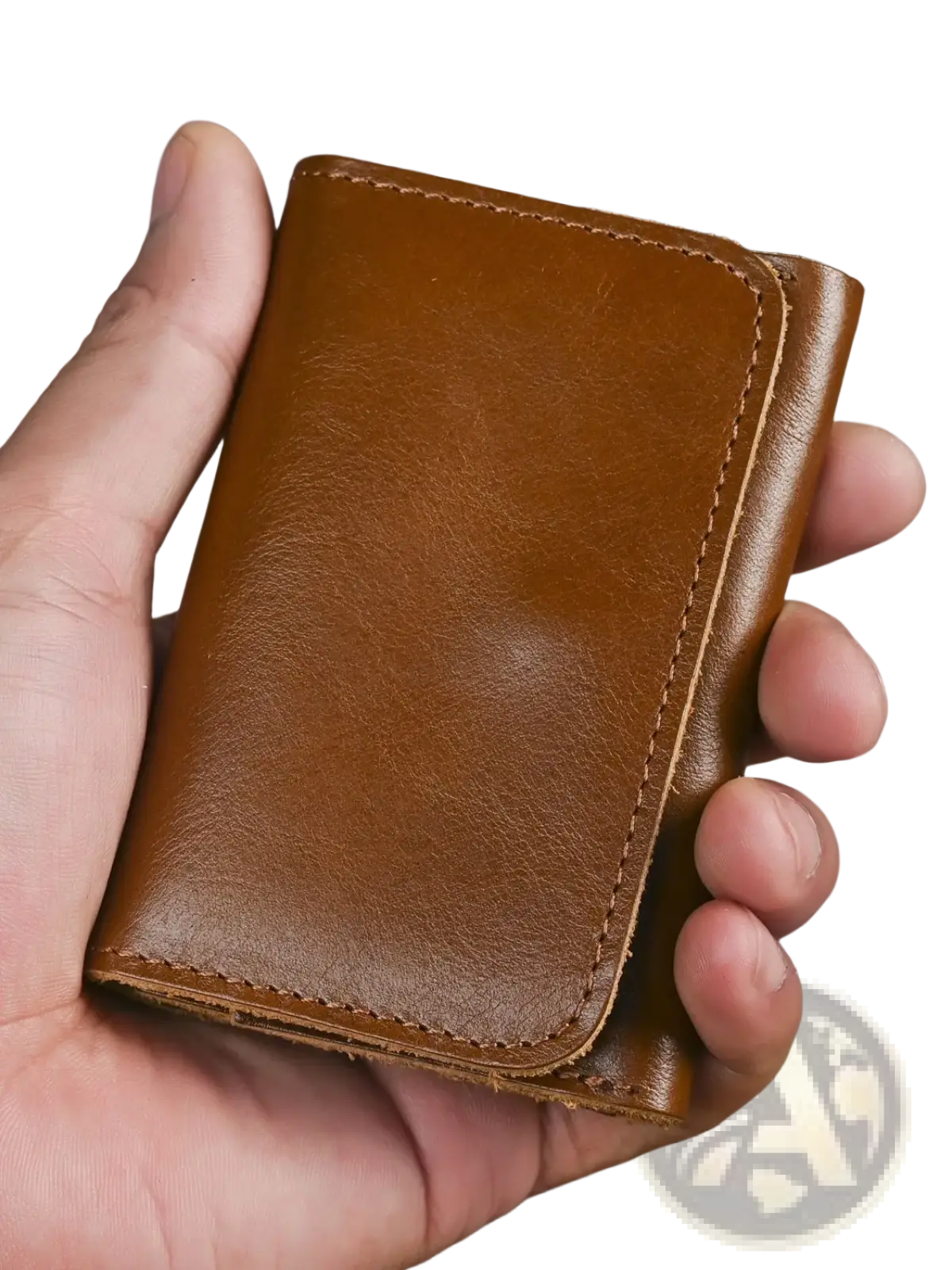 A tan leather trifold wallet with visible stitching made of vintage cowhide designed as a coin purse