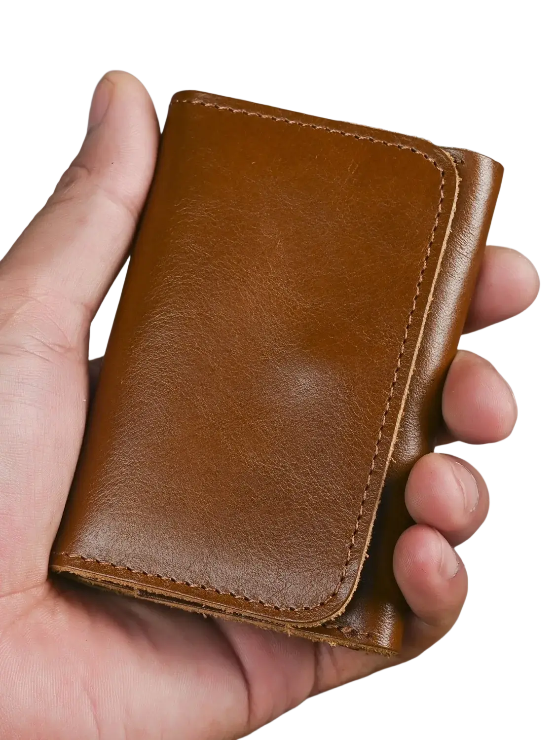 A tan leather trifold wallet with visible stitching made of vintage cowhide designed as a coin purse
