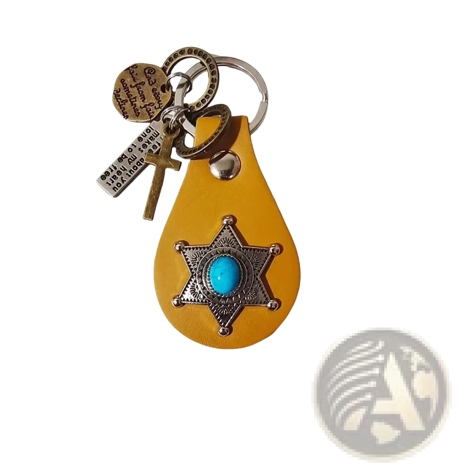 A yellow leather keychain featuring a silver star badge with turquoise stone and additional cross and metal tags charms