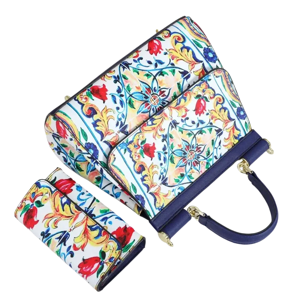 Leather vintage art shoulder bag featuring vibrant floral pattern navy blue leather trim and gold-tone hardware