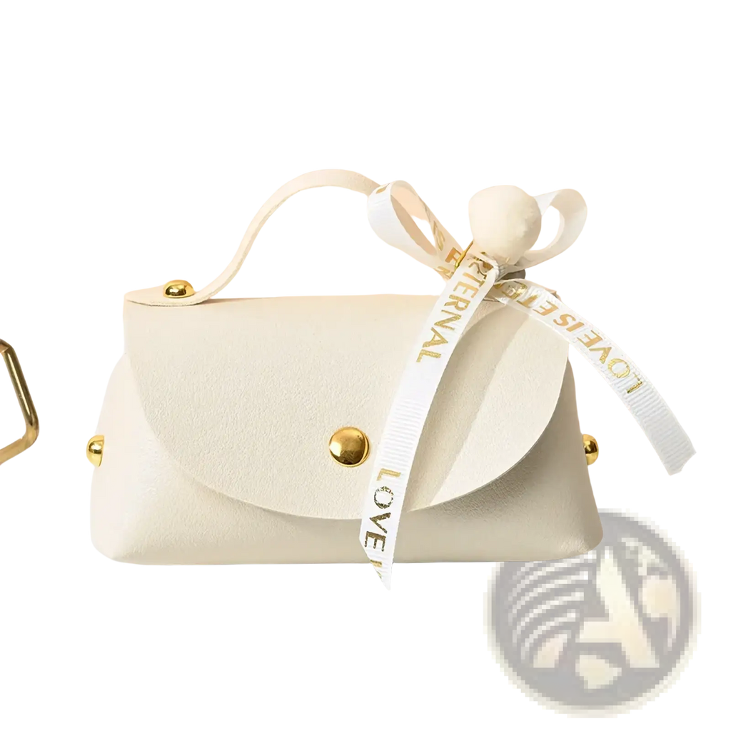 Cream-colored faux leather mini clutch with gold hardware and white ribbon bow for leather wedding favor gift bag use