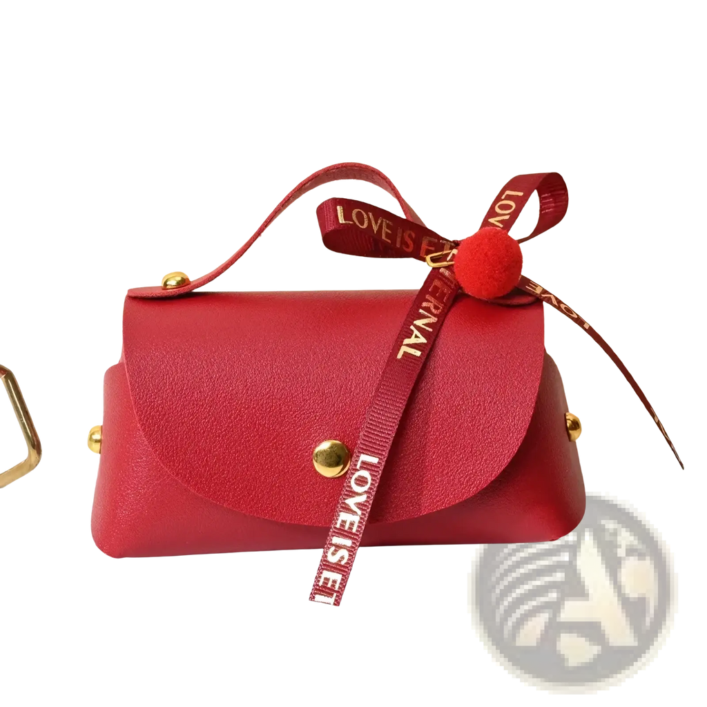 Red faux leather mini handbag with gold-tone hardware and decorative red ribbon bow for leather wedding favor gift bag