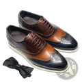 Leather wingtip brogue oxford sneakers in brown and black two-tone leather with perforated detailing