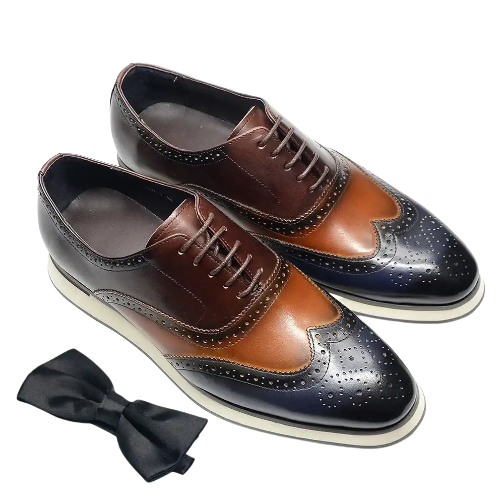 Leather wingtip brogue oxford sneakers in brown and black two-tone leather with perforated detailing