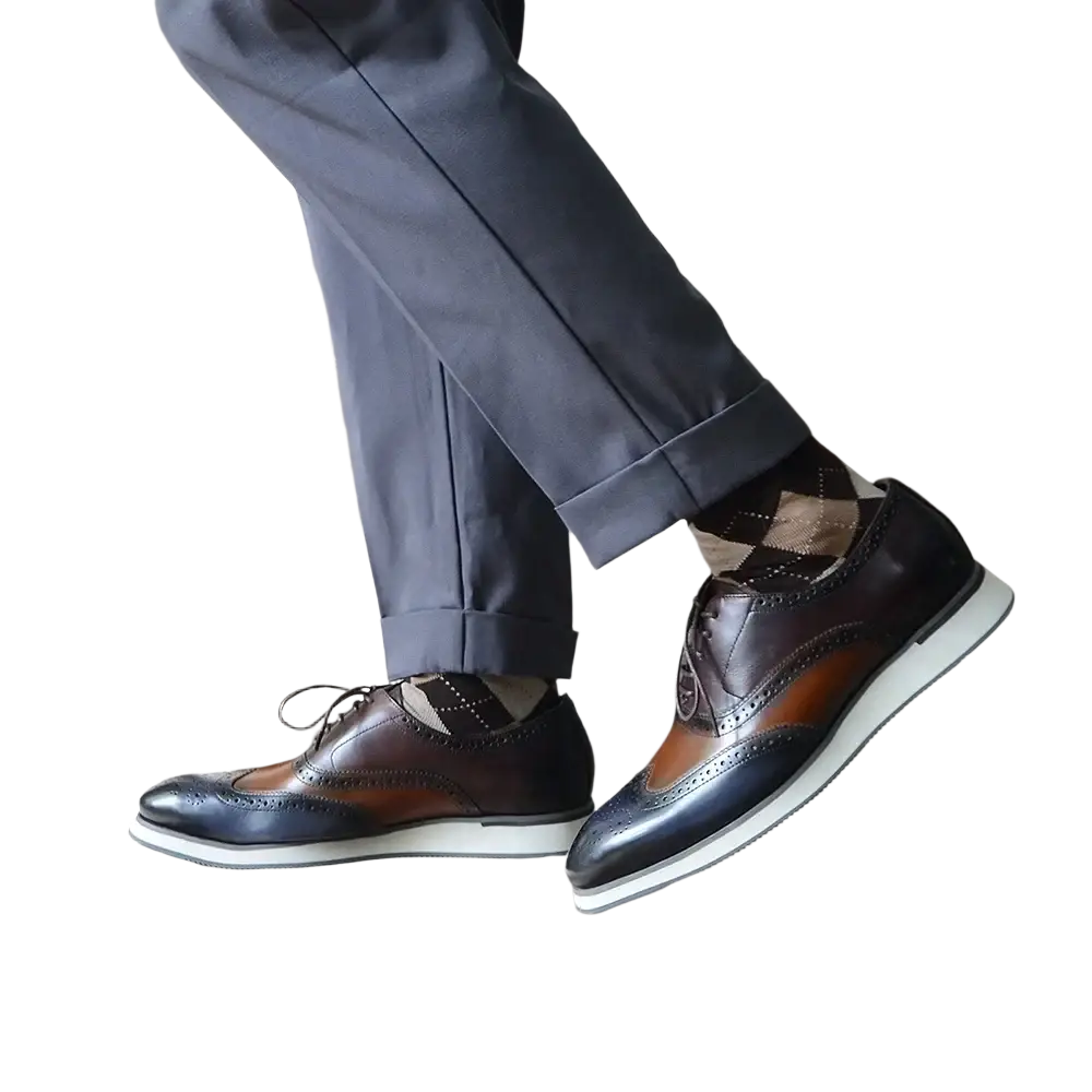 Leather wingtip brogue Oxford sneakers in brown and navy leather with a white rubber sole for dress casual wear
