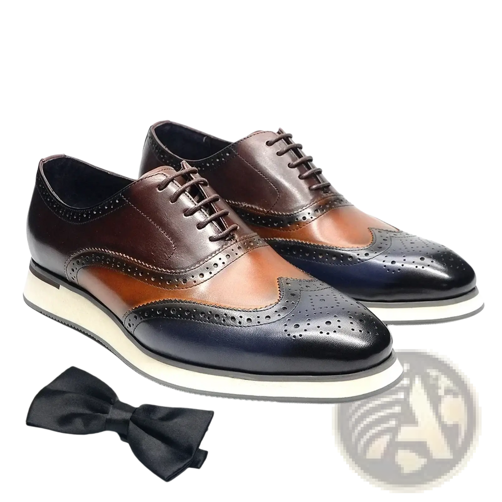 Leather wingtip brogue oxford sneakers in brown tan and black two-tone leather with a white rubber sole