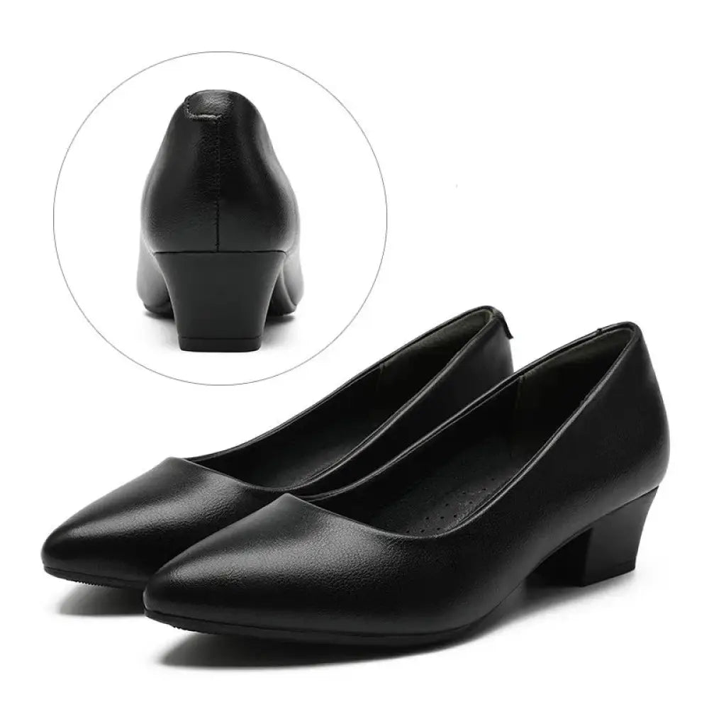Women’s pointed toe black leather professional work flats featuring low block heel and office pump style