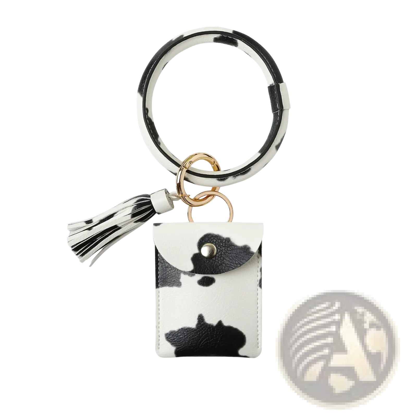 Leather wristlet keychain card holder in black and white cow print with matching tassel and small pouch