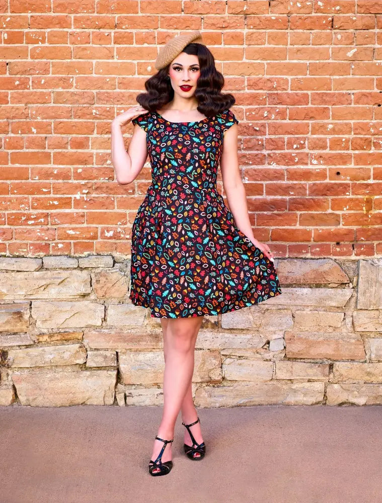 Margaret vintage leaves and acorns cotton a line dress in black with multicolored floral pattern short sleeves and flared skirt