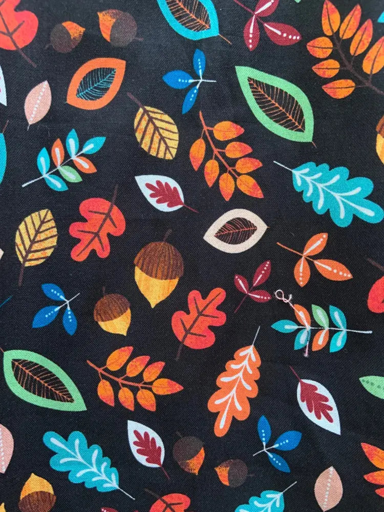 Margaret vintage leaves and acorns cotton a line dress with black fabric featuring colorful autumn leaves and acorns pattern