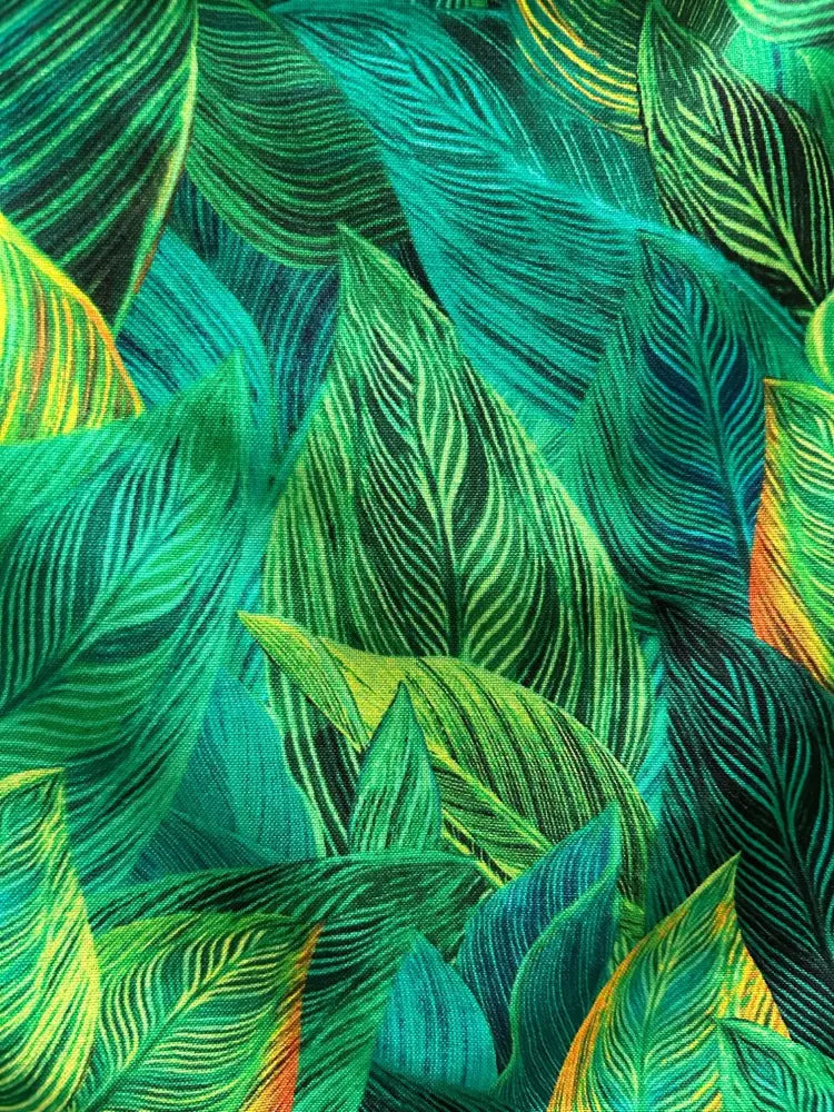 Tropical leaf print 1950s vintage cotton bow blouse featuring vibrant green teal and yellow fabric with detailed vein patterns