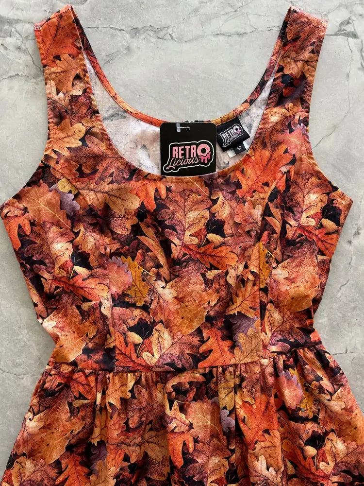 Sleeveless autumn oak leaves vintage fit and flare cotton dress with vibrant orange brown and rust leaf pattern