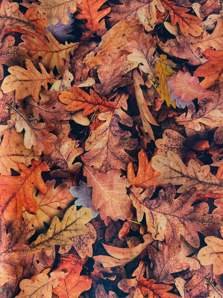 Autumn oak leaves vintage fit and flare cotton dress featuring a dense pattern of orange brown and yellow oak leaves