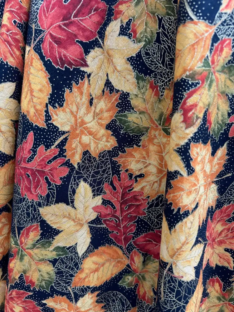 Greta autumn leaves cotton wrap dress with pockets featuring fall fabric in red orange and yellow leaves on navy background