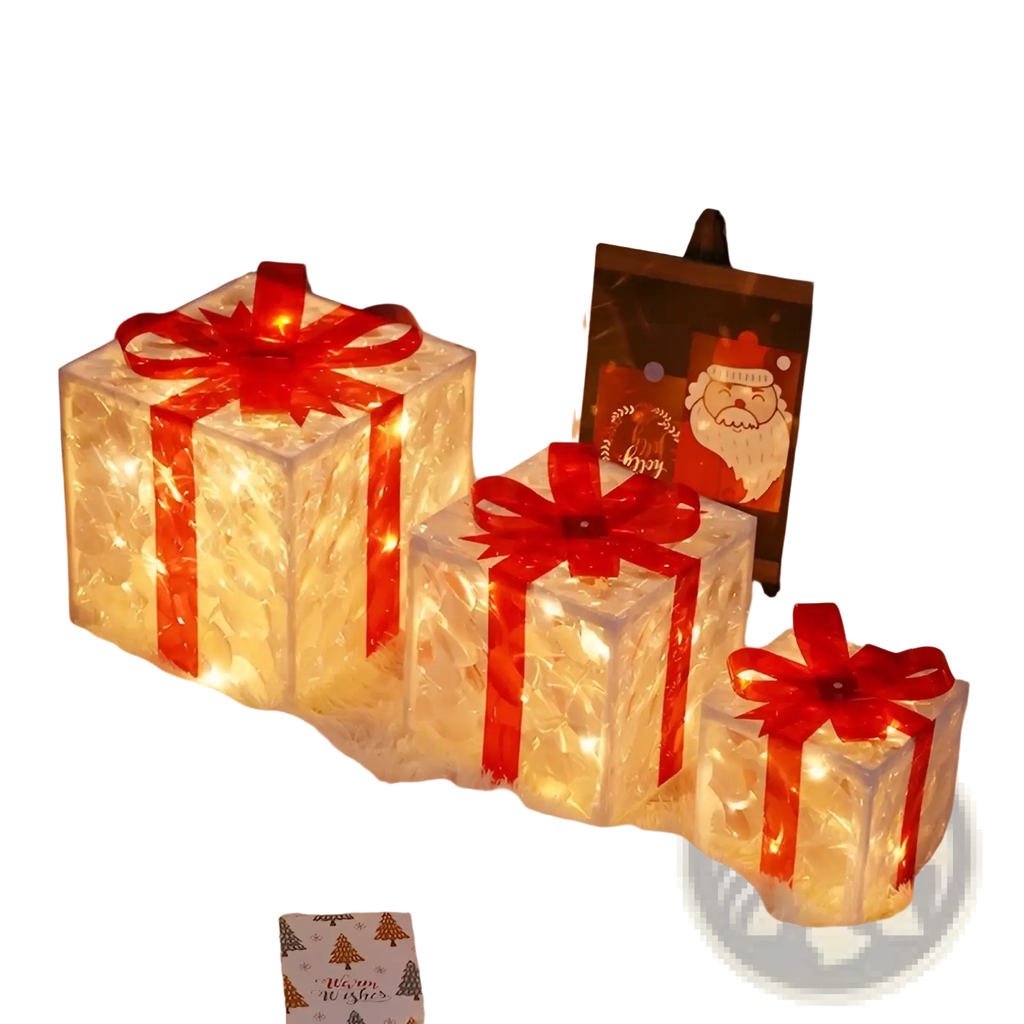 Three illuminated translucent led christmas gift boxes with red glitter bows and ribbons for festive decoration
