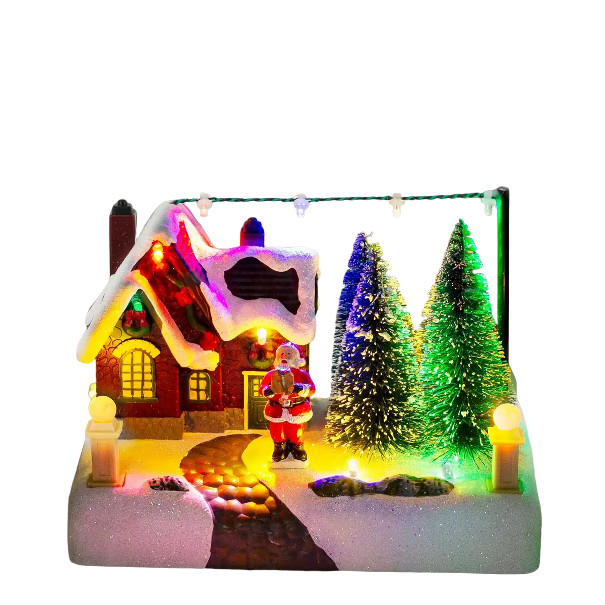 Led Christmas village house with santa and snow featuring a red house with glowing windows and colorful pine trees