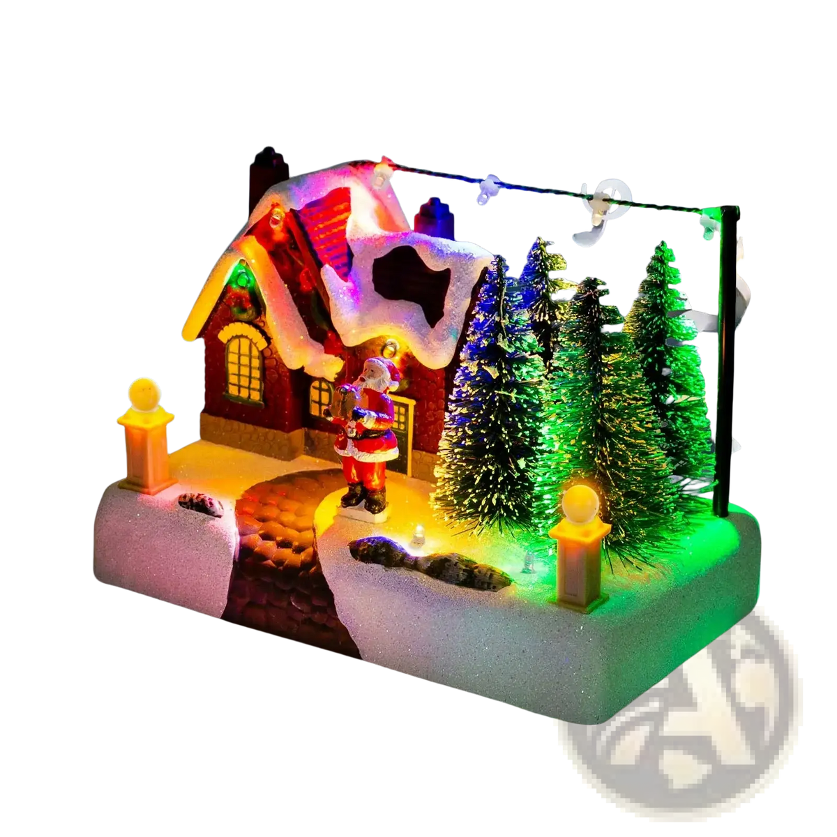 Led christmas village house featuring a red snow-dusted roof with santa and glowing windows surrounded by pine trees