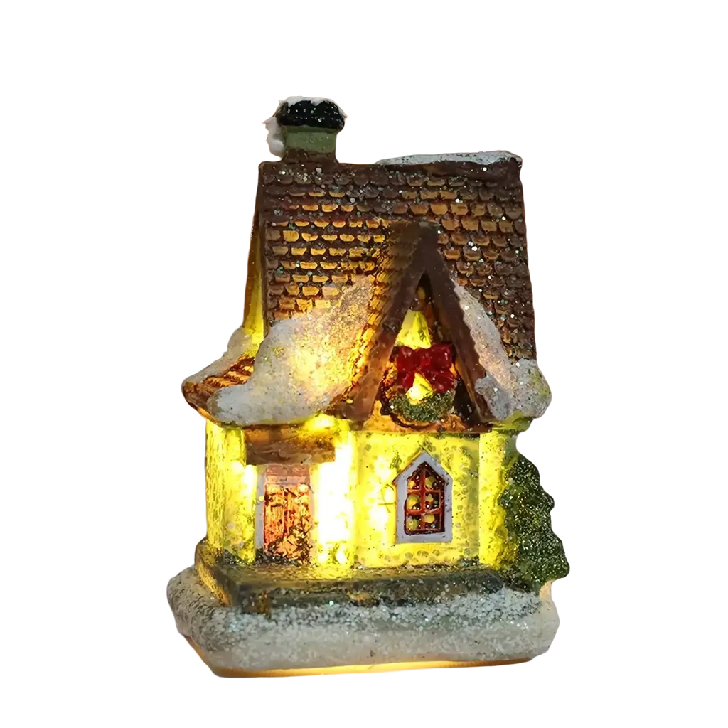 A warmly lit led christmas village house figurine with brown shingled roof snow-dusted details and glowing lights