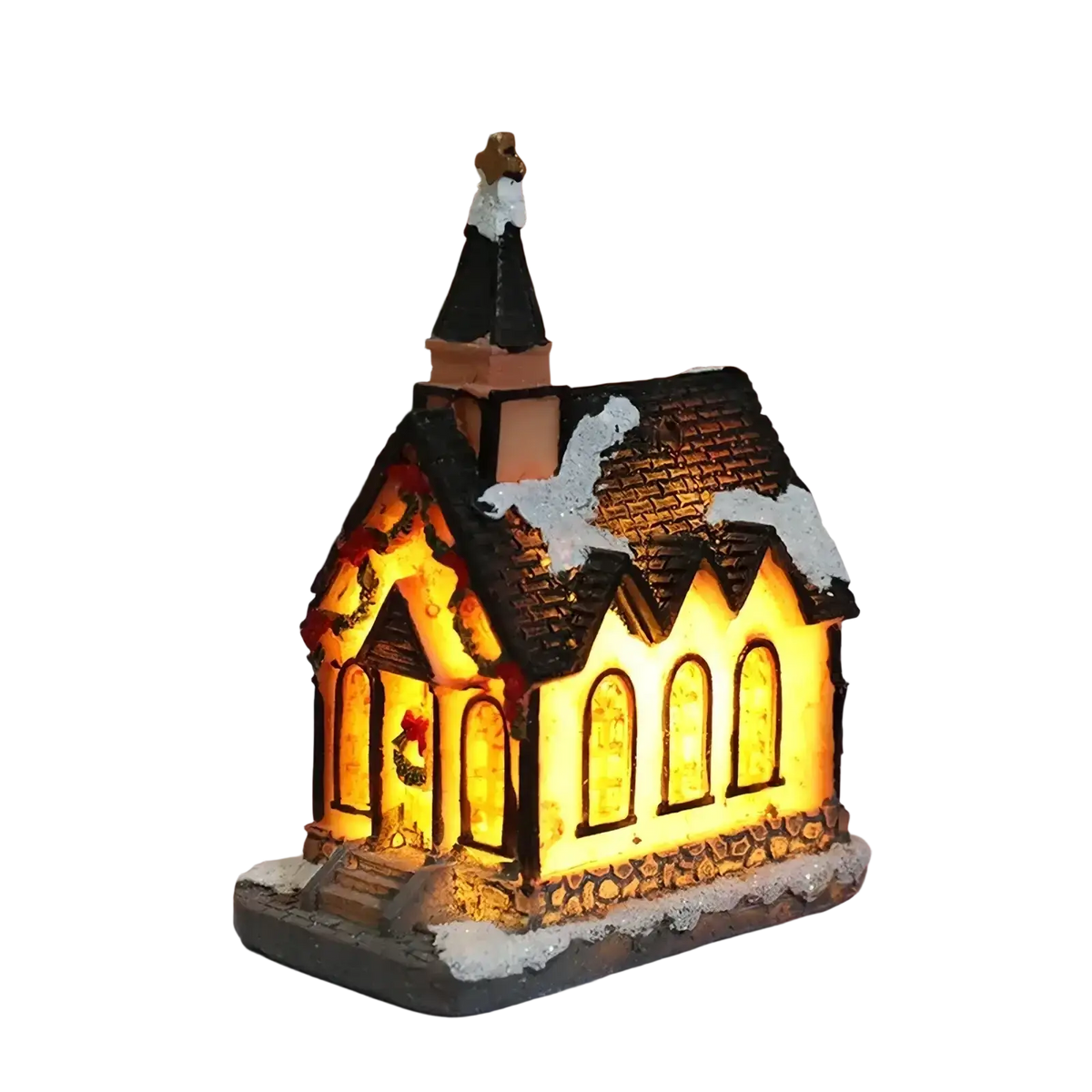A warmly lit led christmas village miniature church figurine with a black shingled roof and glowing arched windows