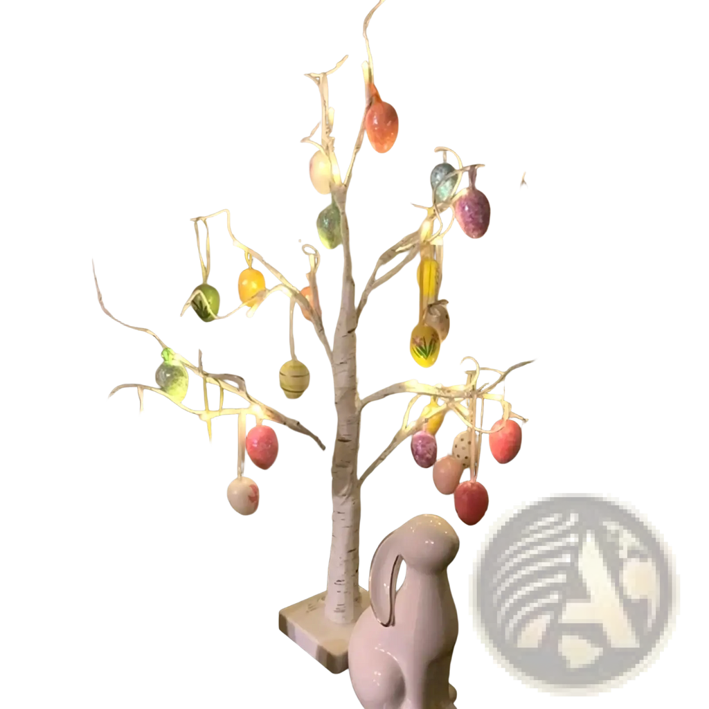 Led easter birch tree decoration with white branches, colorful glossy eggs, and warm string lights hanging ornaments