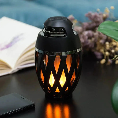 Black lantern-style arbaglobal led flame bluetooth speaker with woven lattice design and warm orange internal light