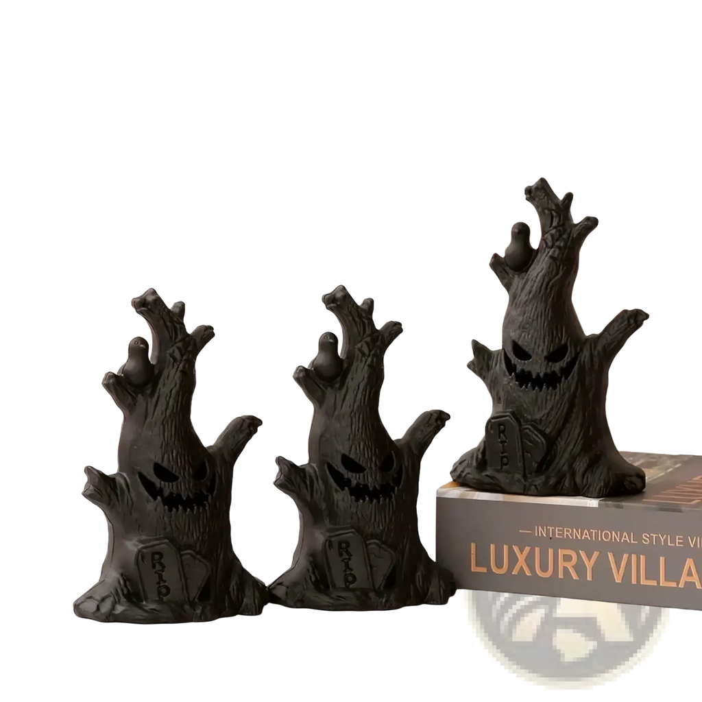Three black resin led halloween ghost tree lights with carved jack o lantern faces and rip tombstone bases