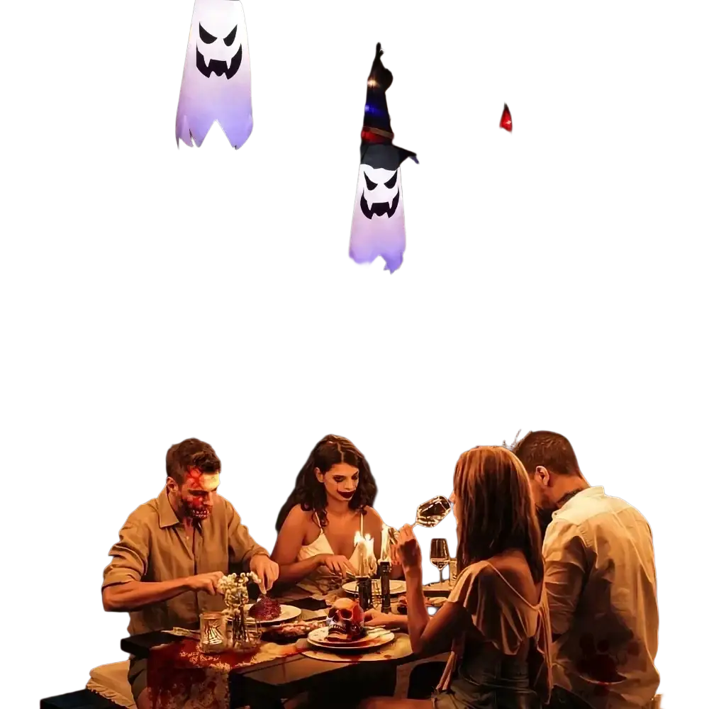Led hanging ghost halloween decoration with white inflatable ghosts and colorful witch hats above outdoor dinner