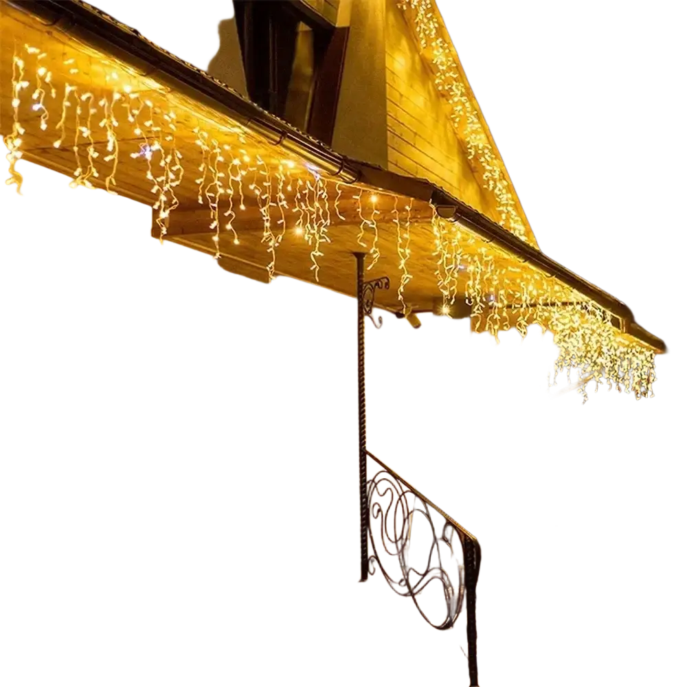 Warm white led icicle string light draped along house eaves for outdoor home decoration and fairy string light use