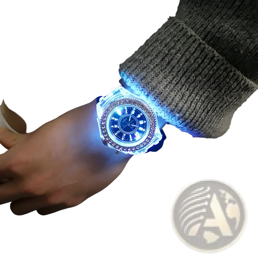 A blue led luminous silicone watch with a transparent case and rhinestone bezel worn on a wrist