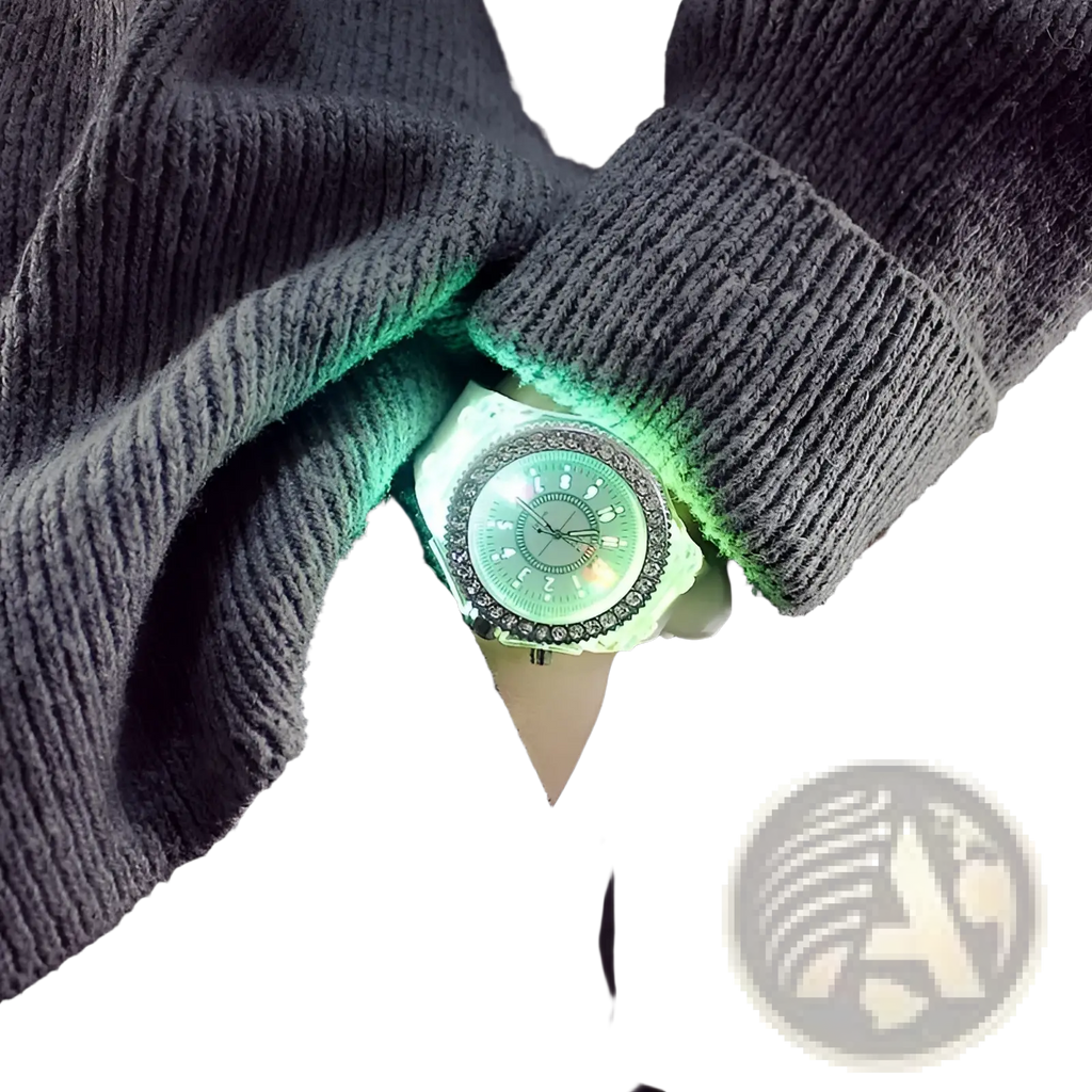 A led luminous silicone watch with a glowing green face and sparkling rhinestone bezel worn under a gray knitted sweater