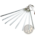 Led meteor shower rain string lights with clear translucent icicle design and evenly spaced white bulbs for indoor outdoor use