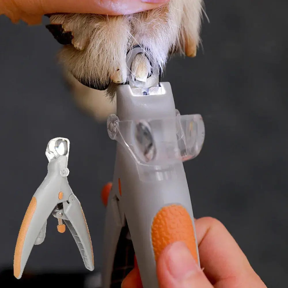 Led cat nail clipper with precision safety light featuring gray and orange textured grip handles for secure use
