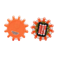 Bright orange circular led road flare emergency safety beacon with textured surface and three embedded lights shown front and back
