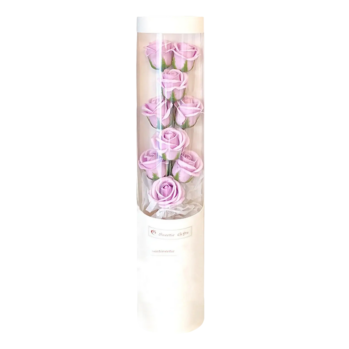 A clear cylindrical container holding six lavender soap roses with green stems in a led rose soap flower gift box for Valentine’s Day