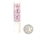 A clear cylindrical container holding six lavender soap roses with green stems in a led rose soap flower gift box for Valentine’s Day