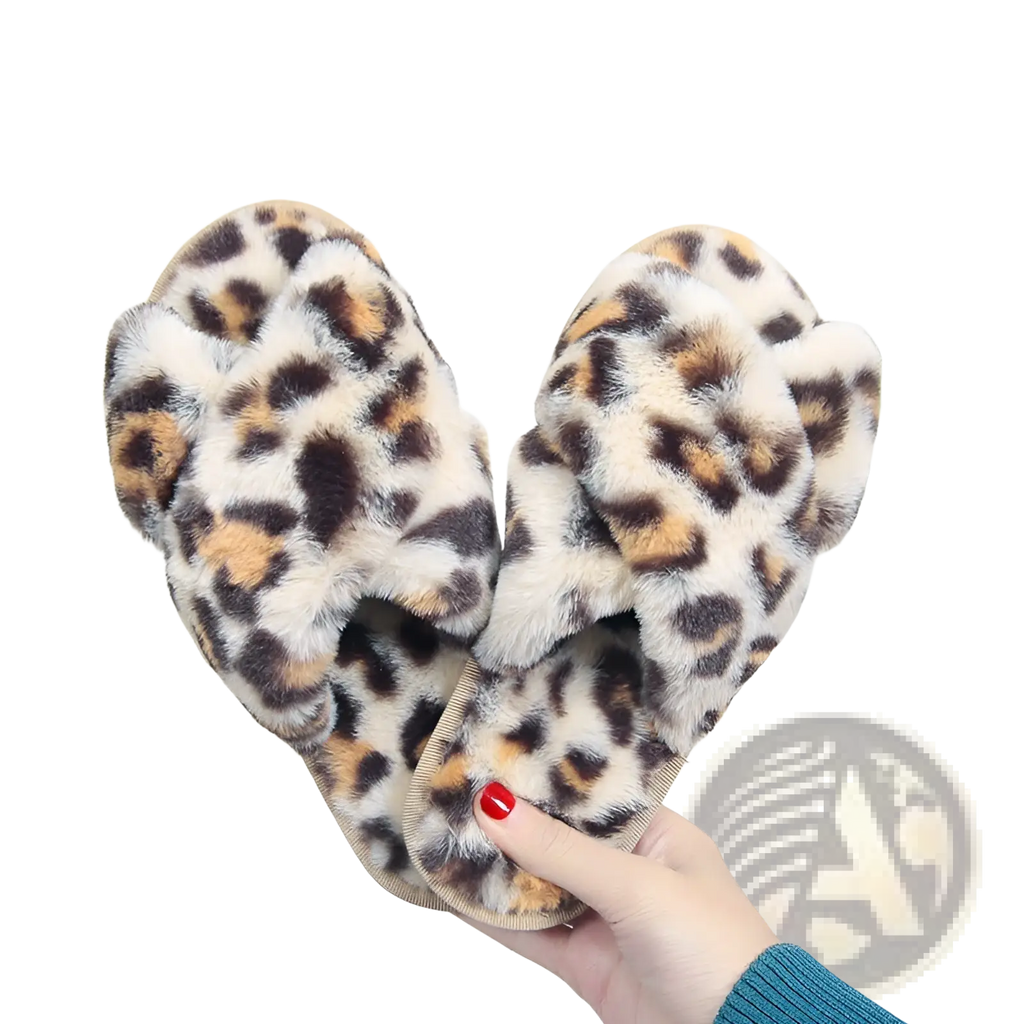Leopard fuzzy cross strap plush house slippers with soft furry texture and tan black and brown leopard print spots