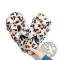 Leopard fuzzy cross strap plush house slippers with soft furry texture and tan black and brown leopard print spots