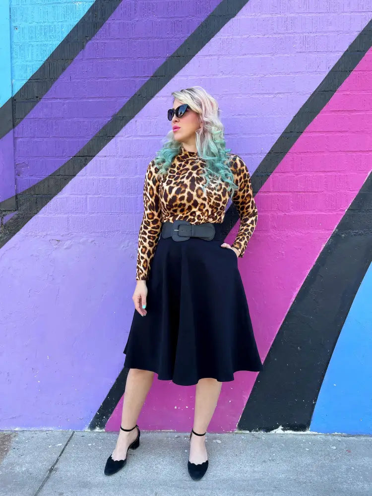 Vintage leopard print long sleeve top with mock neck and fitted silhouette in brown and black tones