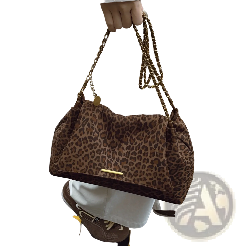 Brown leopard print crossbody bag with gold tone chain strap and metallic clasp for stylish everyday use