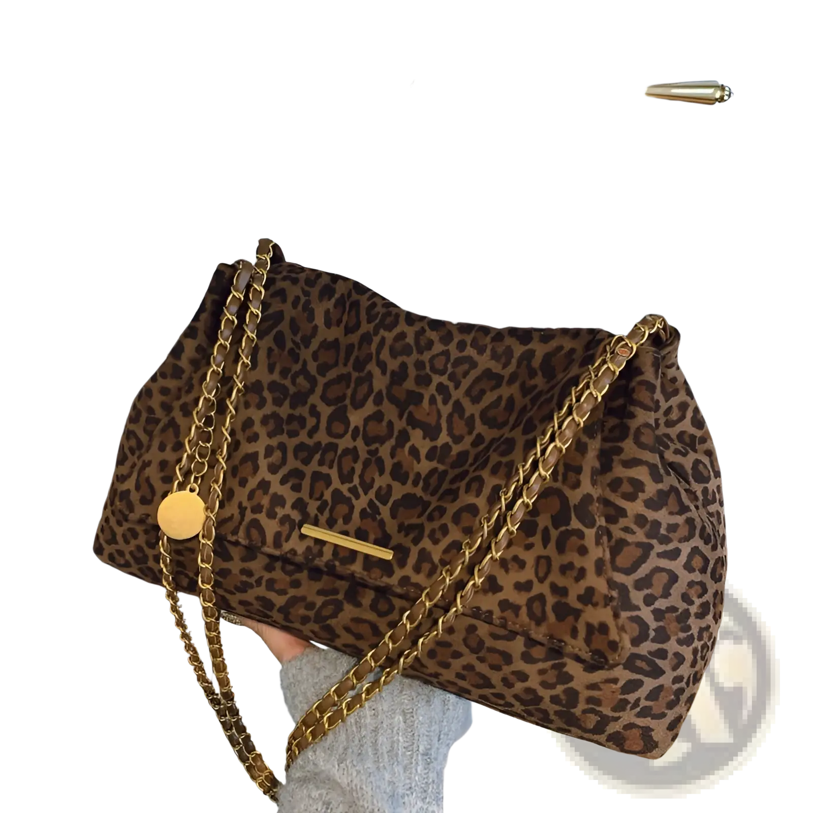 A brown leopard print crossbody bag with a gold chain strap and matching gold circular charm