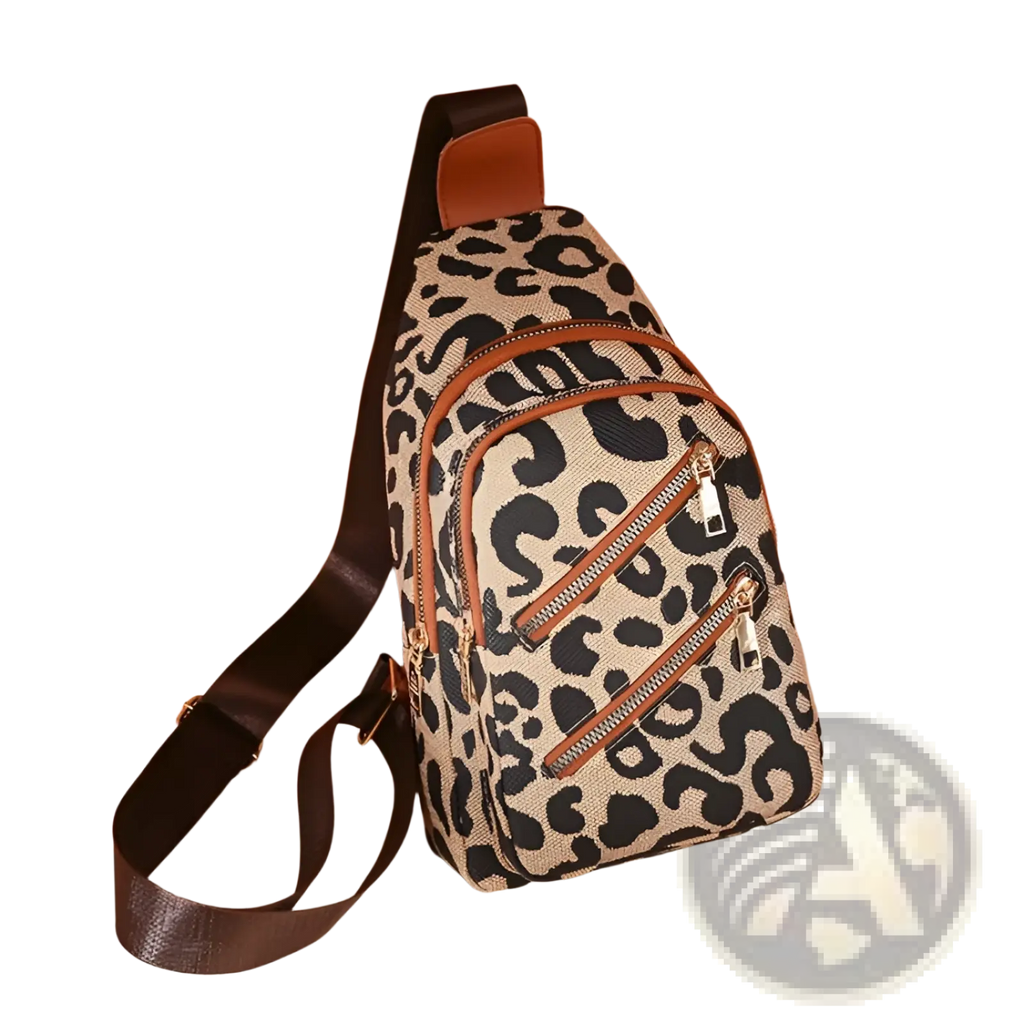 Leopard print crossbody bag with headphone jack featuring canvas material and brown leather accents with zippers