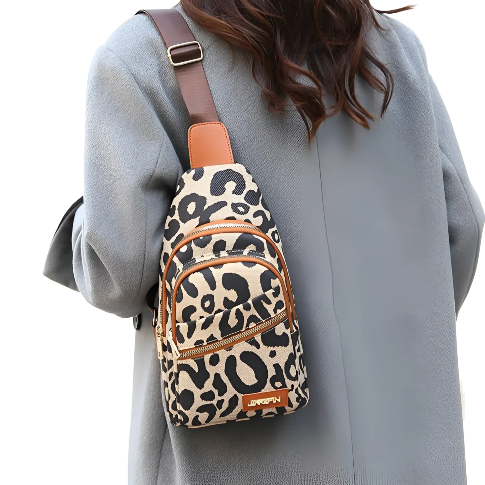 Leopard print canvas crossbody bag with tan leather accents zipper details and headphone jack for convenient use